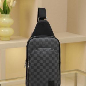 All-Steel Hardware Crafted from Damier Graphite canvas, this Avenue shoulder bag features a Louis Vuitton Paris leather patch adorning the front exterior pocket. The adjustable nylon shoulder strap attaches to either side via D-rings, while the canvas shoulder strap and lining reflect sustainable design principles.Damier Graphite coated canvas Cowhide leather trim Fabric lining Square metal hardware on front Main compartment Zippered front pocket Small zippered top pocket Non-removable, adjustable shoulder strap! Dimensions: 20x31x7cm